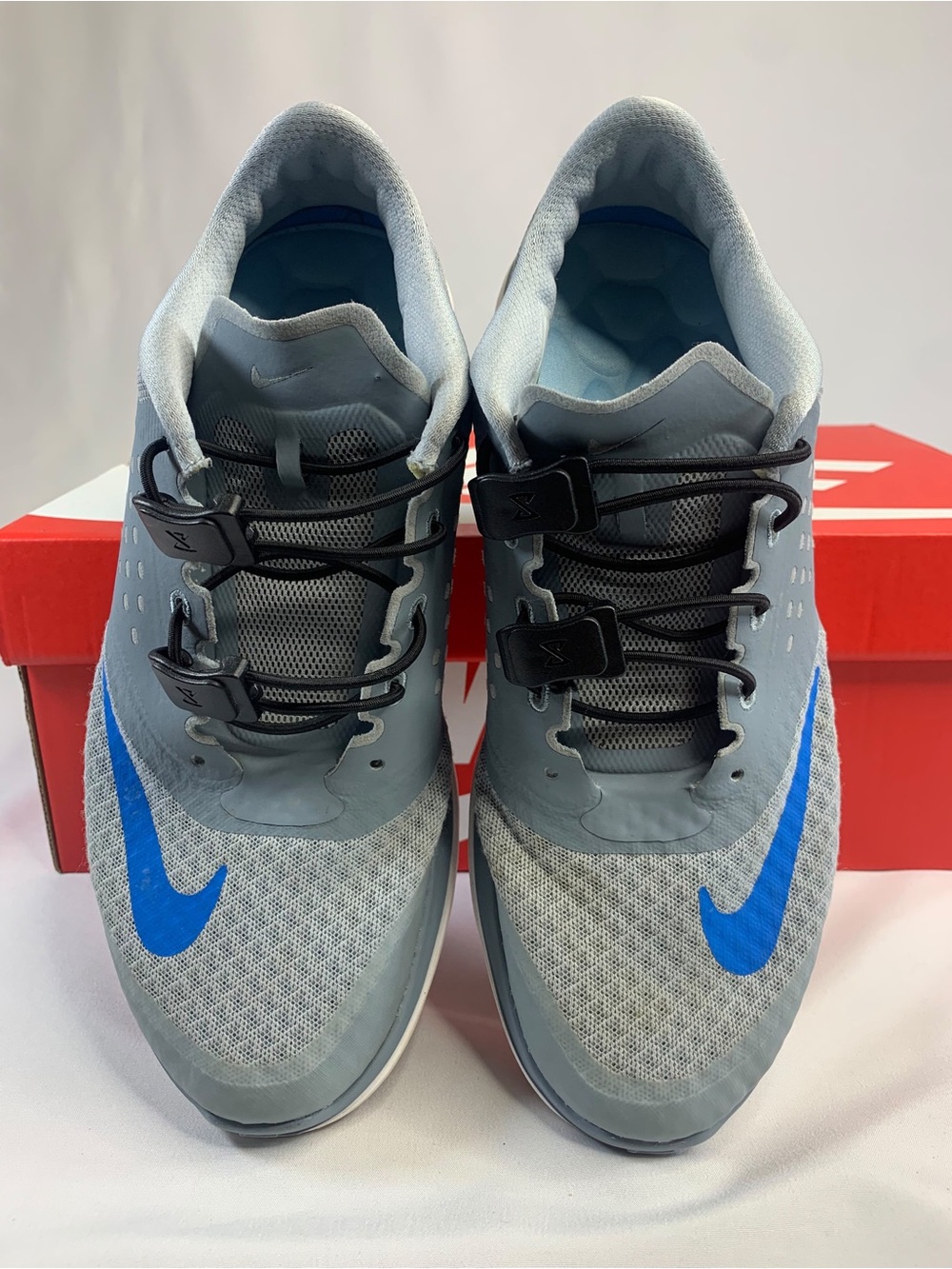Nike Men’s Grey Athletic Shoes with Blue Swoosh